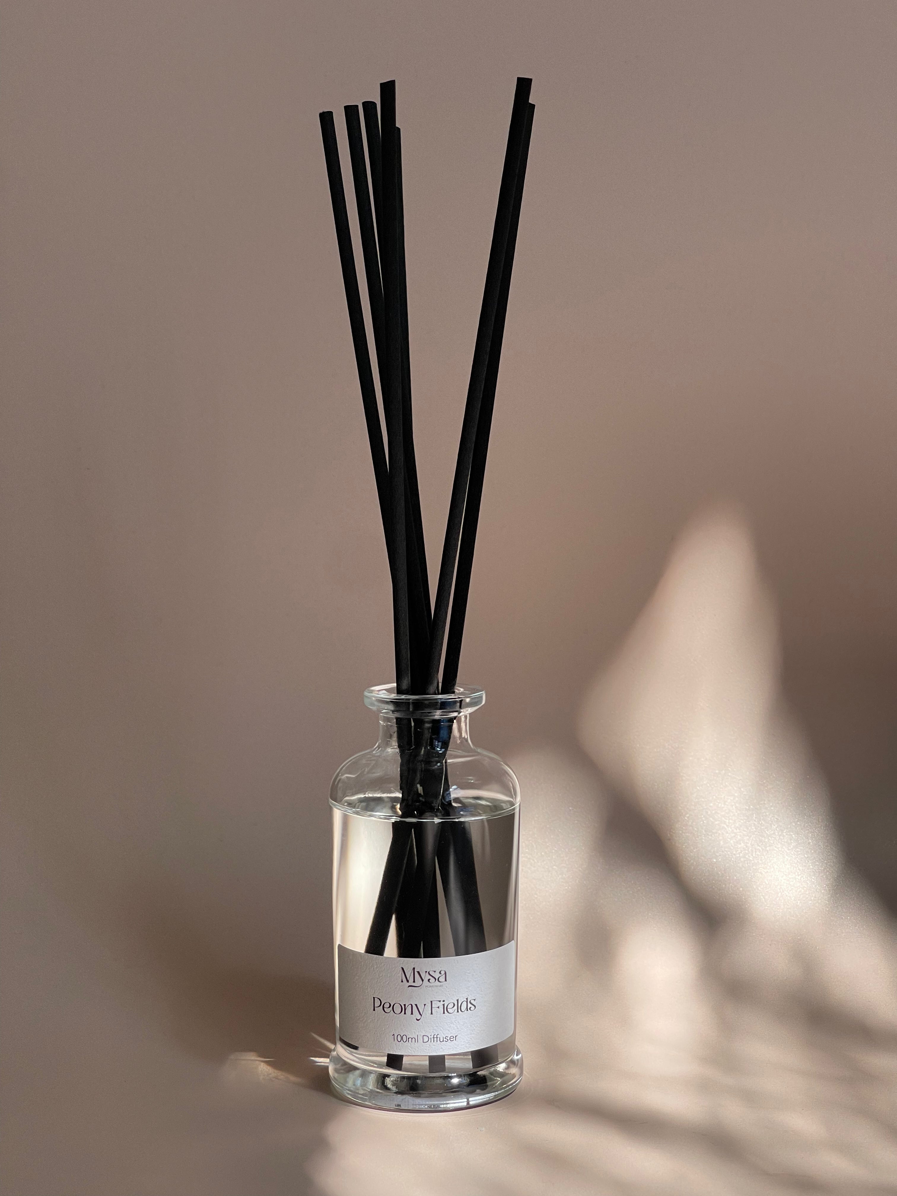 Peony Fields luxury reed diffuser in gift box, featuring a vegan base oil infused with Velvet Peony & Oud fragrance.