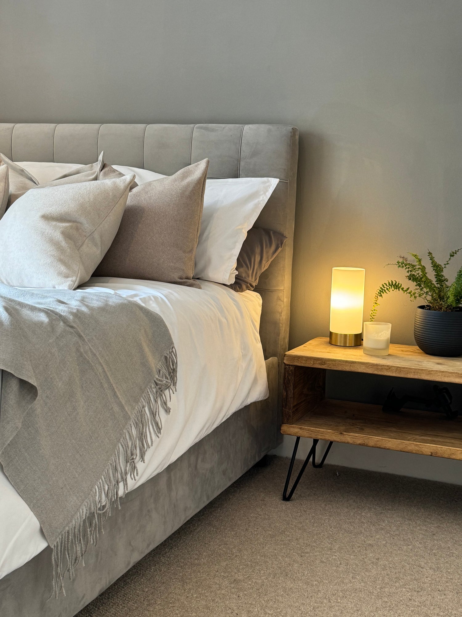 Bed adorned with Mysa Homeware's neutral luxury cushions, adding elegance and comfort to the bedroom decor.