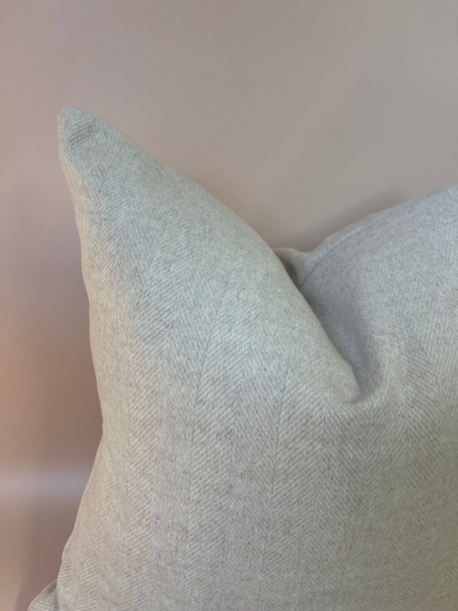 Soft neutral cream wool blend cushion, perfect for adding texture and luxury comfort to your living space.