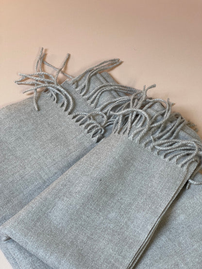 Soft, thin grey bed runner, adding a subtle layer of texture and warmth to your bedding ensemble.