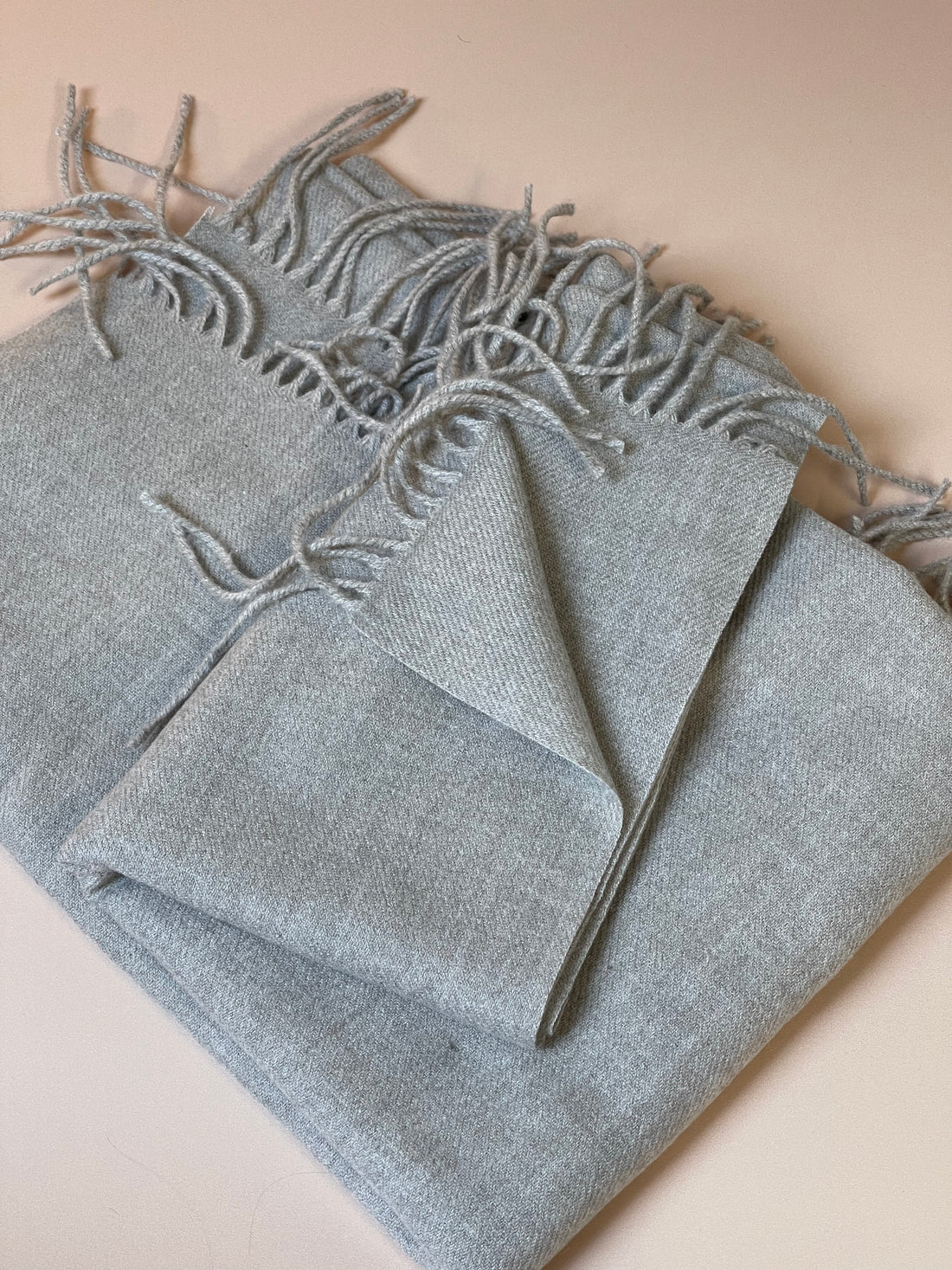 Soft, thin grey bed runner, adding a subtle layer of texture and warmth to your bedding ensemble.