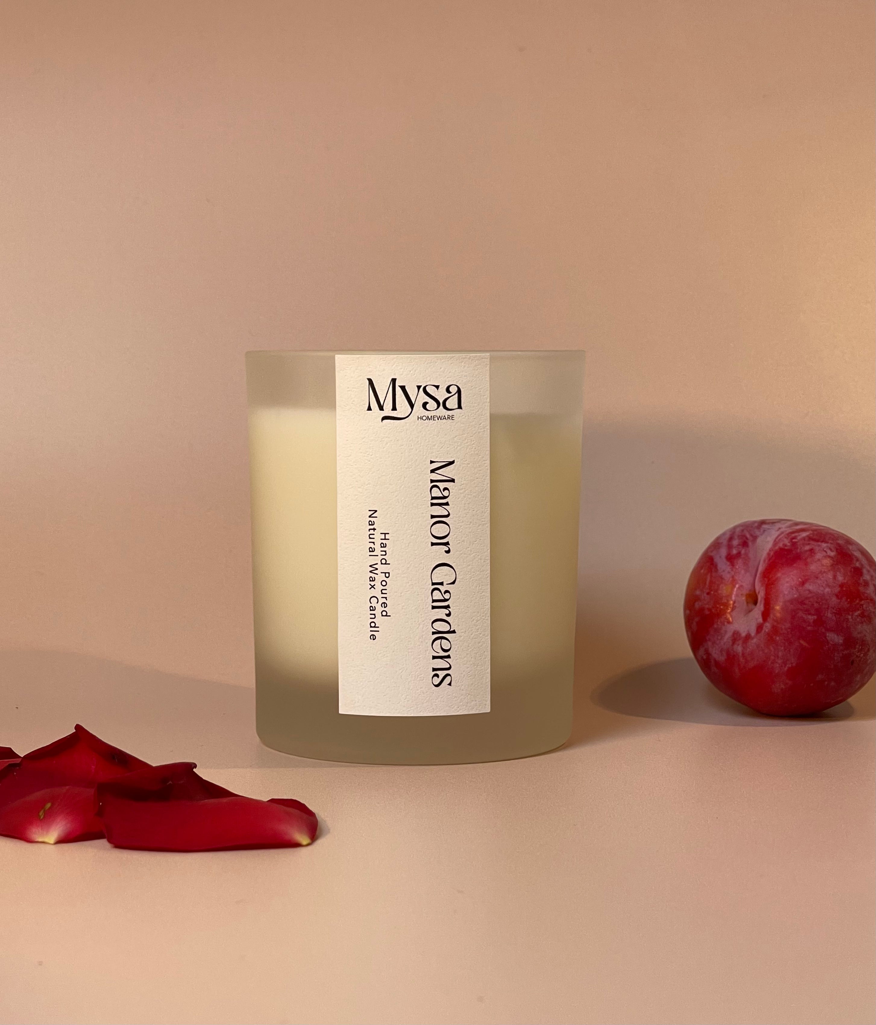 Manor Gardens luxury scented candle crafted from natural wax, featuring a delightful blend of damson plum, rose, and patchouli fragrance.