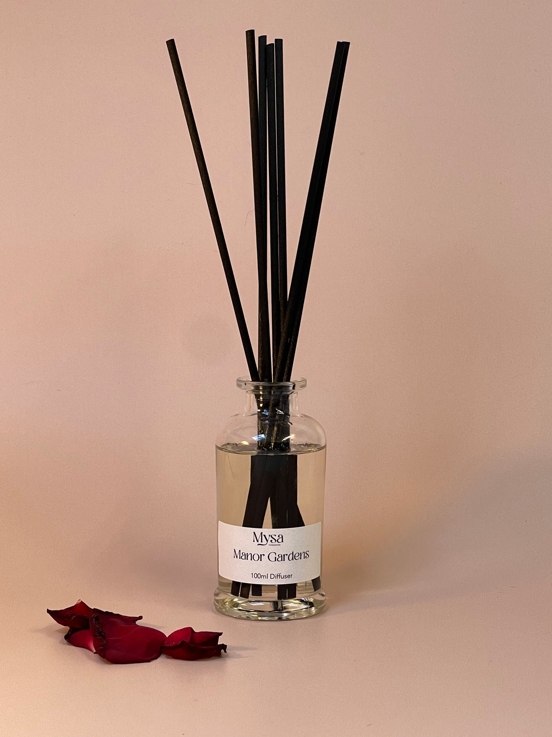Manor Gardens luxury reed diffuser in gift box, featuring a vegan base oil infused with damson plum, rose and patchouli fragrance.