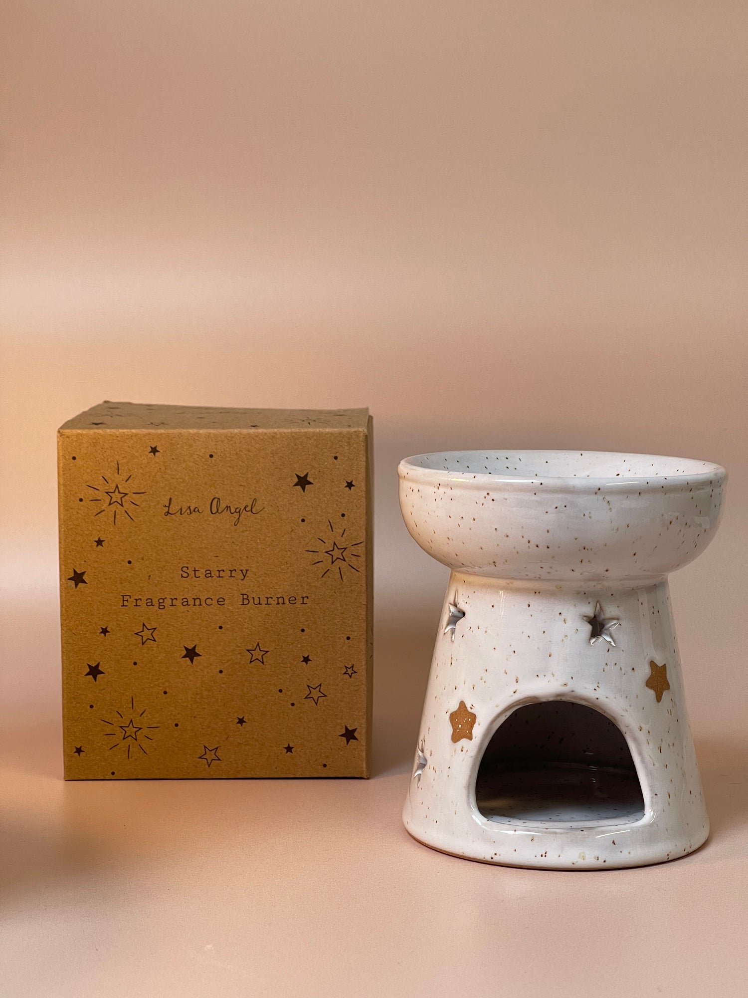 Starry-themed wax melt burner featuring a celestial design, perfect for melting wax melts and infusing your space with luxury fragrances.