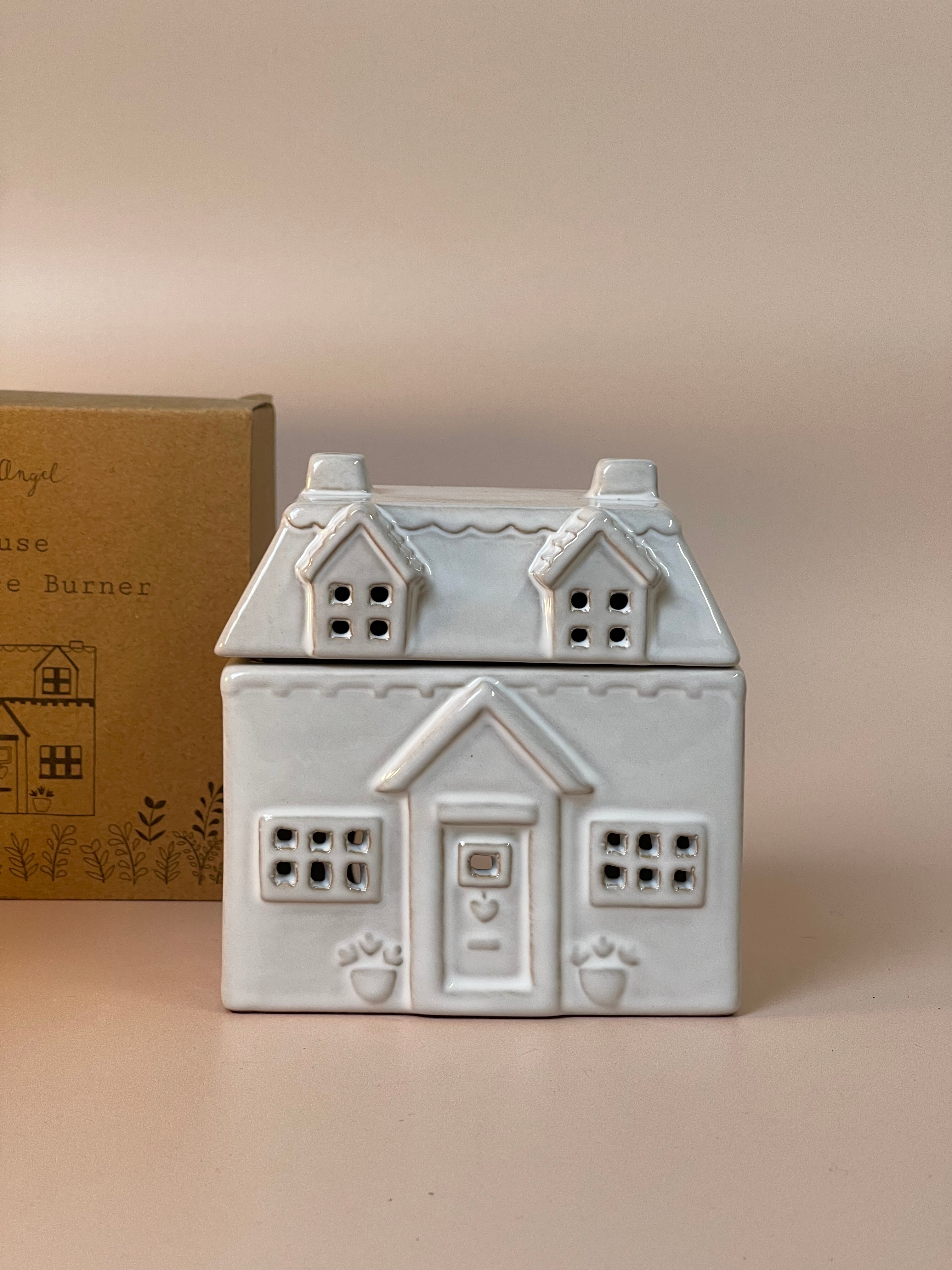 House-shaped wax melt burner with intricate detailing, designed to melt wax melts and fill your home with delightful fragrances