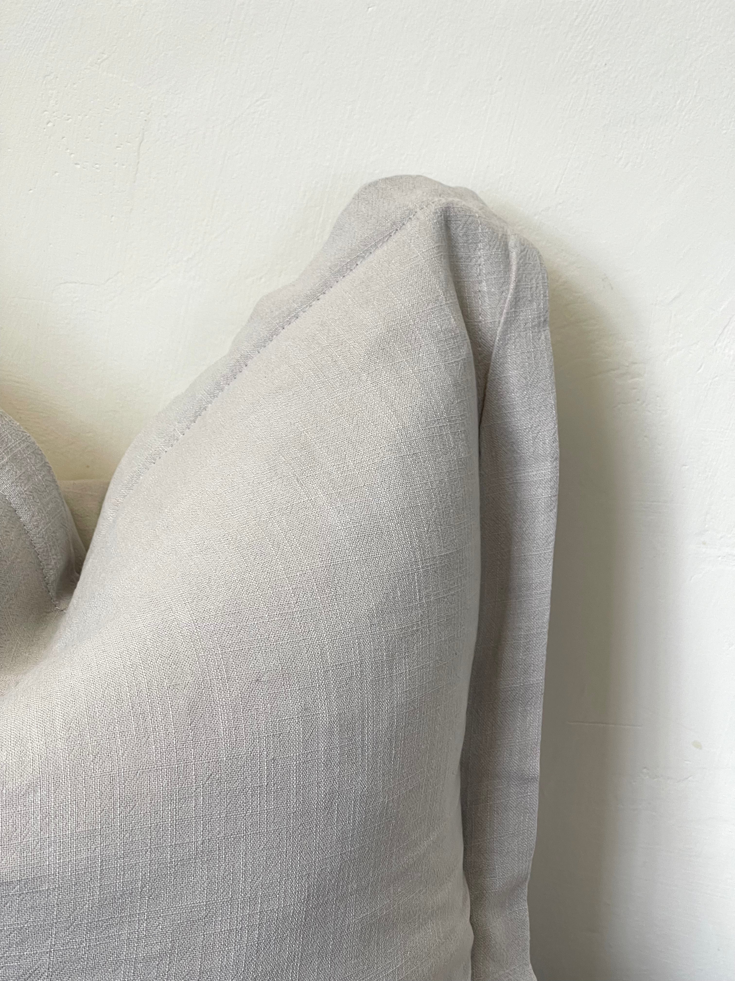 Luxury linen blend cushion in light grey, ideal for complementing a neutral aesthetic in home decor.