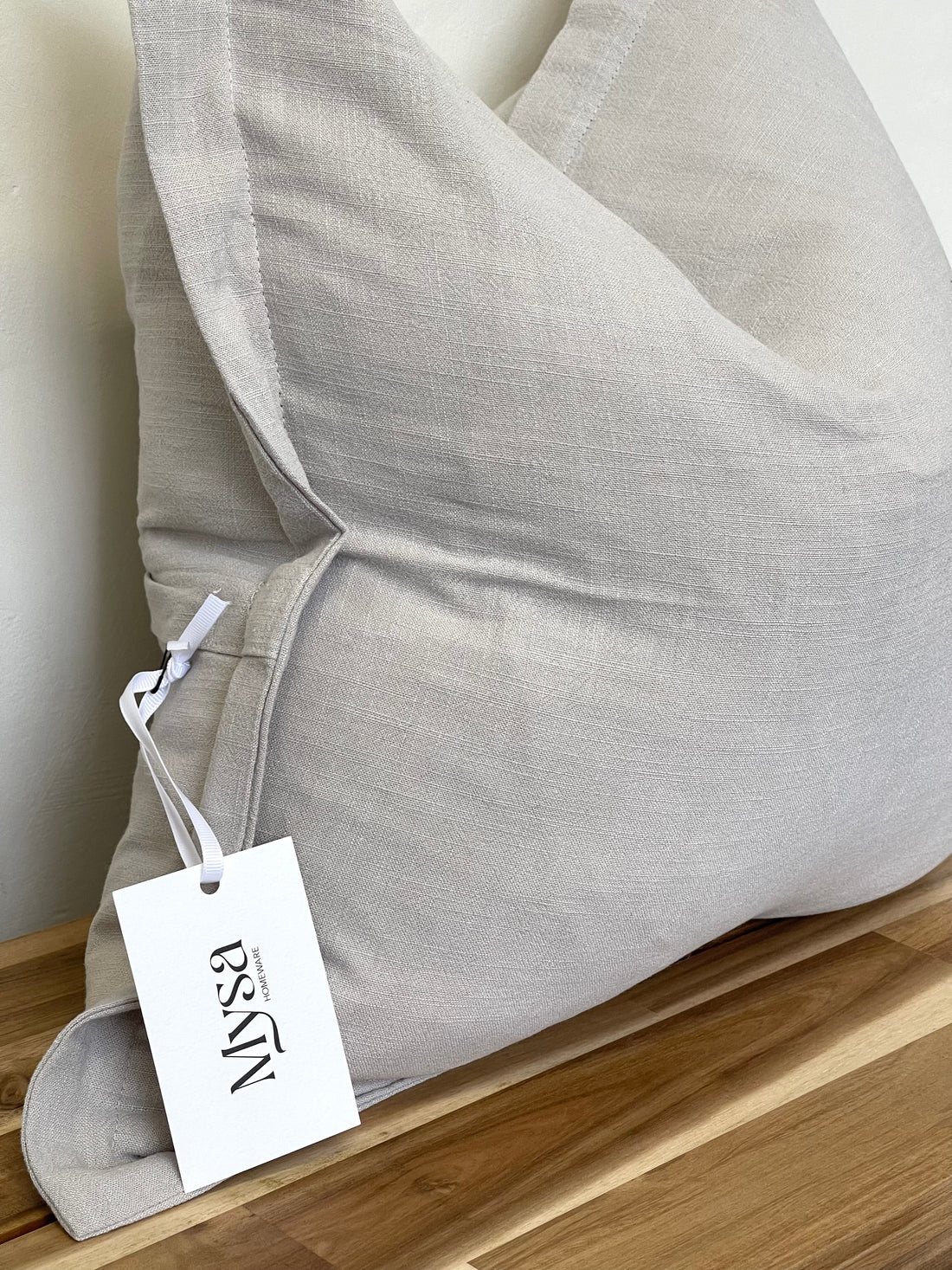 Luxury linen blend cushion in light grey, ideal for complementing a neutral aesthetic in home decor.